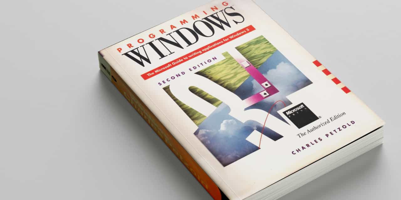 A photograph of a book title 'Programming Windows: Second edition'.