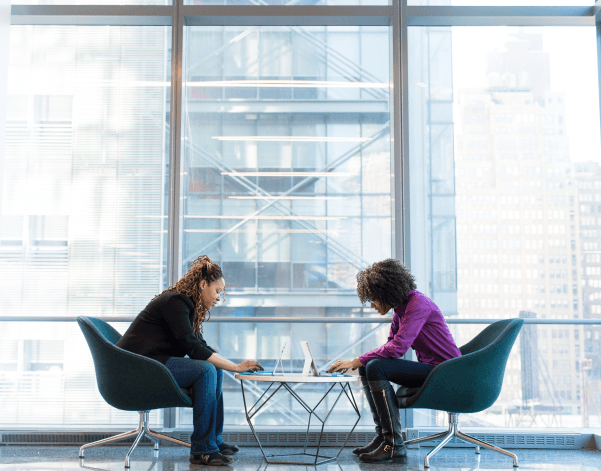 Office workers in front of a window